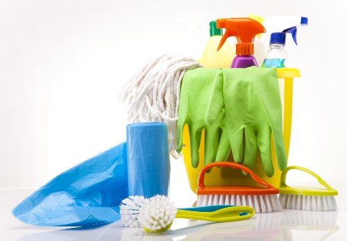 Upholstery and carpet cleaning process in progress with extraction tools