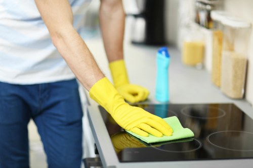 Office cleaning team maintaining desks and shared areas